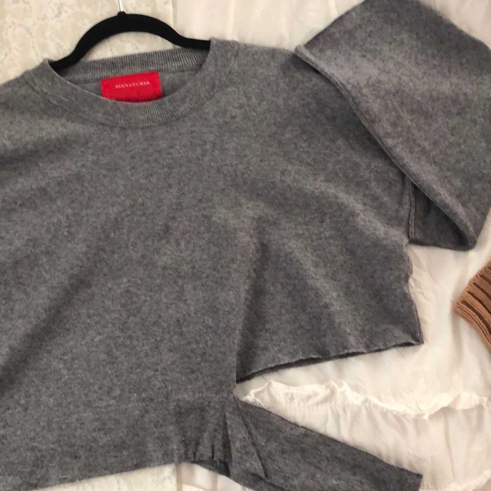 Disconnected cropped sweater